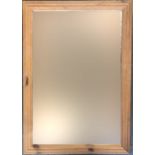 A pine framed wall mirror, 104x73cm