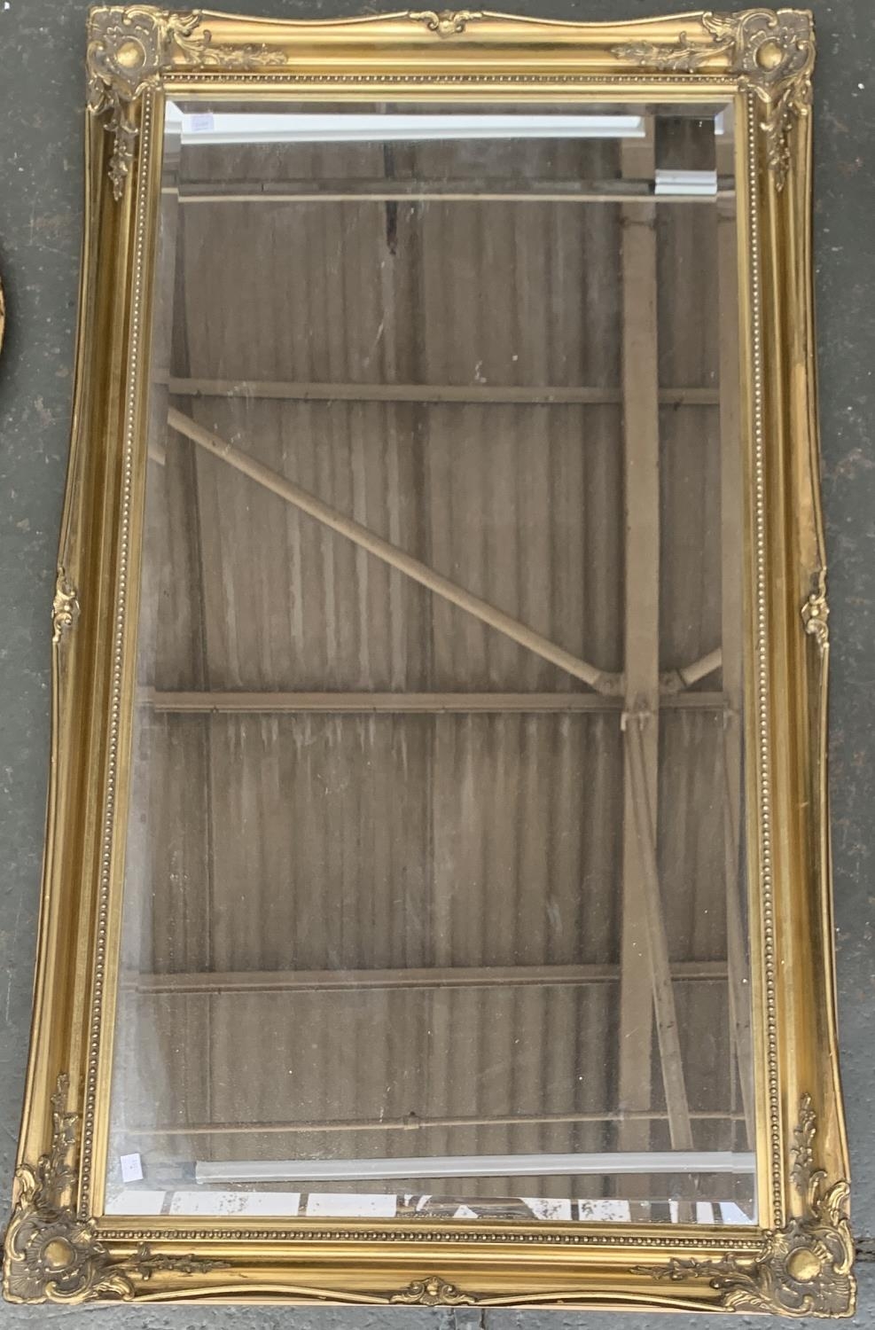 A large gilt framed mirror with bevelled glass plate, 116x60cm