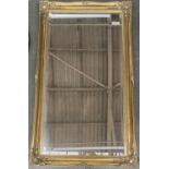 A large gilt framed mirror with bevelled glass plate, 116x60cm