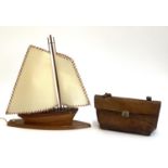 A table lamp in the form of a ship, together with a stitched leather handbag