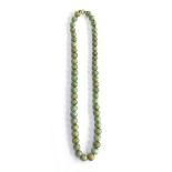 An early 20th century graduated jade bead single strand necklace, with gold bolt clasp, 43cmL (