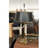 A gilt metal trefoil base table lamp, with dark green shade, 75cmH