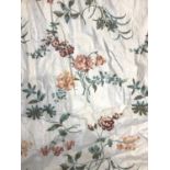 A pair of chintz curtains, lined and interlined, with tiebacks, 214cm (7ft) drop 270cm wide