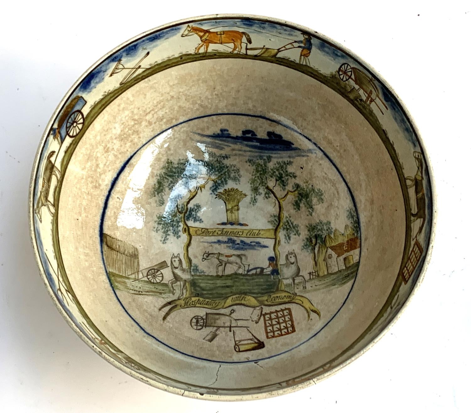 An 18th century English Delftware bowl, underglaze painted, bearing crest 'Port Farmer's Club, Hospi - Image 3 of 8