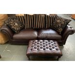 A modern brown vinyl upholstered button back three seater sofa, approx. 245cmW; together with a