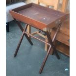 A teak butlers tray on folding stand, 59x43cm