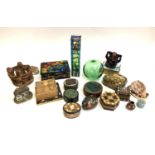 A mixed to include a number of trinket pots and boxes, papier mache, green glass fisherman's