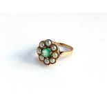 A 14ct gold cluster ring set with a central emerald surrounded by a halo of pearls, size N,