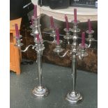 A pair of five arm candlesticks, 80cmH