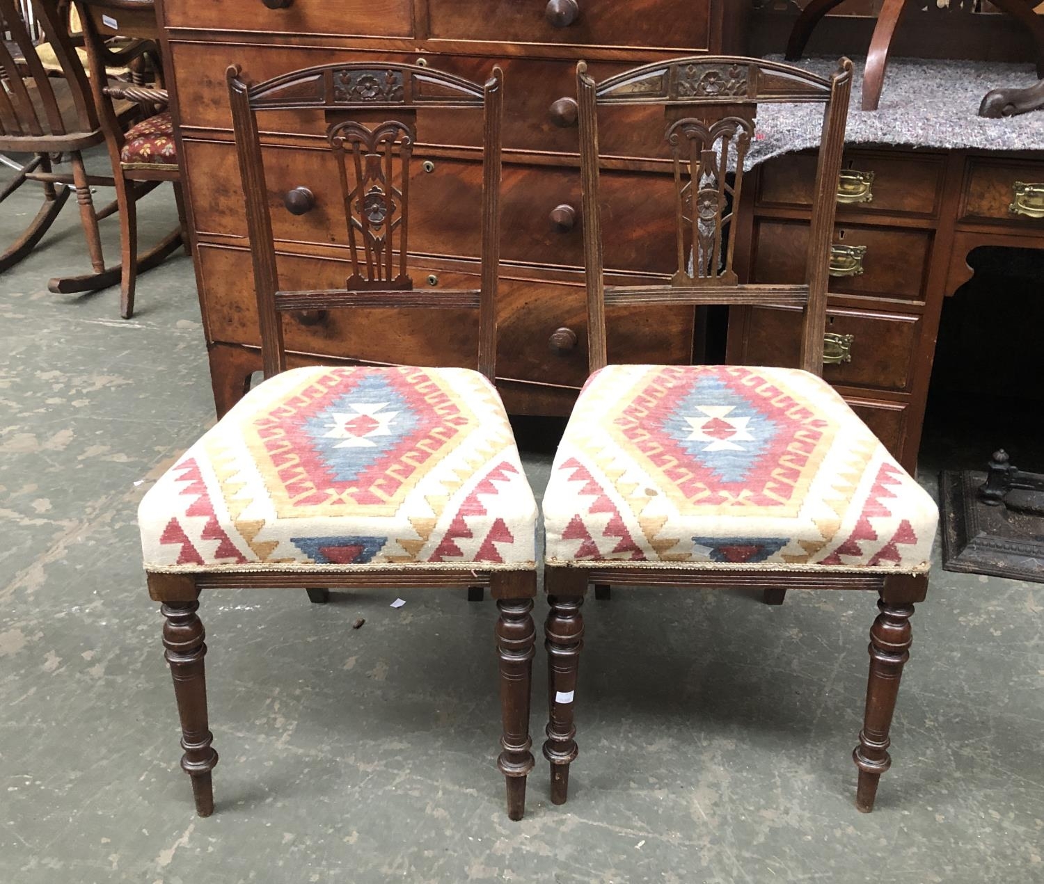 A pair of oak side chairs with kilim style stuffover seats