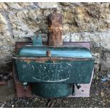 A vintage enamel toilet cistern, reading 'Kay Bros, AT Knight Plumbers, Bridport'