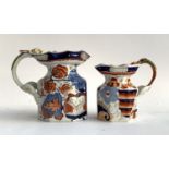 Two 19th century Ironstone China imari pattern octagonal jugs, with dragon handle, heightened in