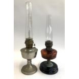 Two vintage oil lamps, the taller 60cm including chimney
