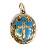 A Victorian gold engraved locket, the front with cross on a blue enamelled shield (af), the back