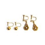 A pair of 9ct gold ball screw back earrings, approx. 1.6g; together with a further pair of floral