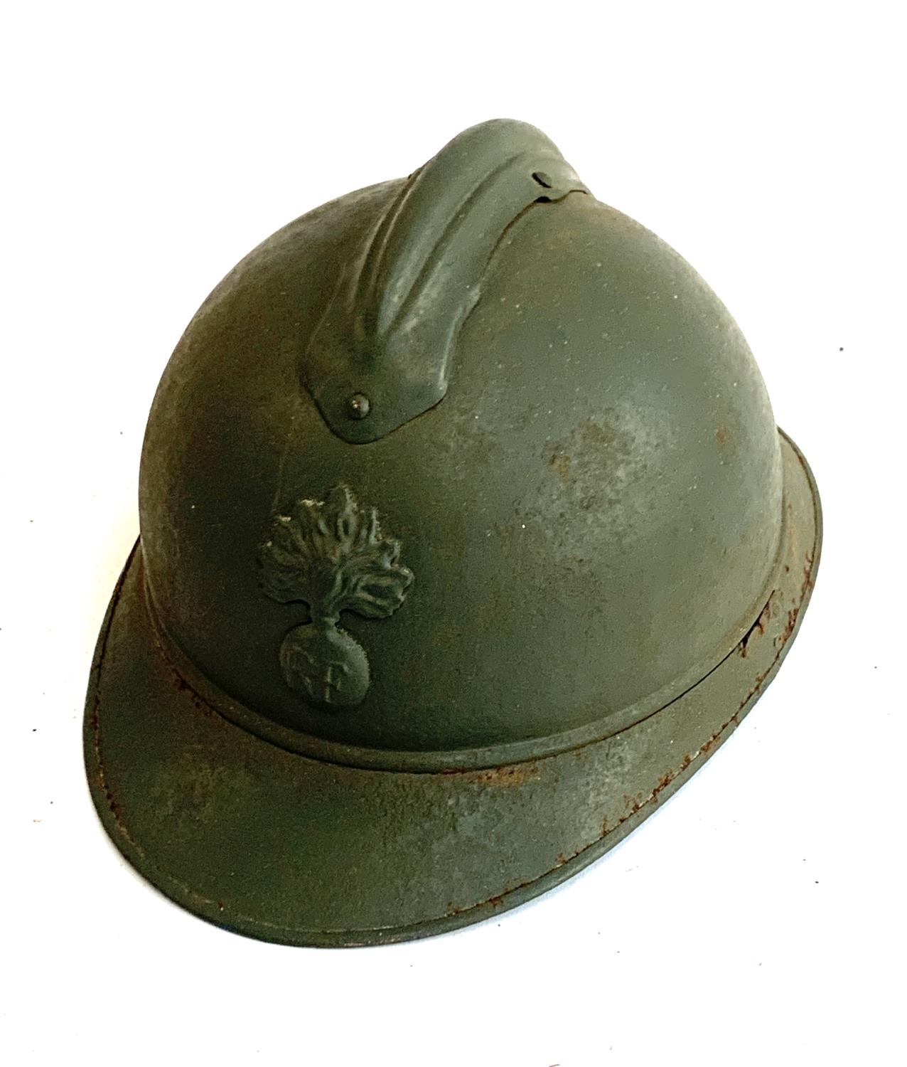 A WWI French M15 helmet with RF badge