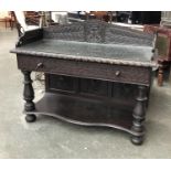 A Victorian oak buffet, carved three quarter gallery, carved single drawer, on turned supports and