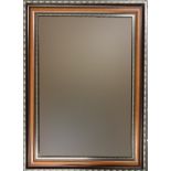 A rectangular wall mirror with bevelled glass, 91x66cm