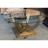 A circular glass topped centre table, with pierced Eastern style metal base, 120x56cmH