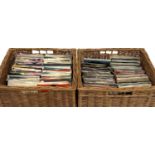 Two wicker baskets of 7 inch singles to include Adam and the Ants, Frank Sinatra, Stevie Wonder,