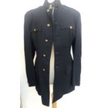 A small navy military tunic jacket with brass buttons