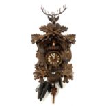 A Black Forest carved cuckoo clock, approx 42cmH