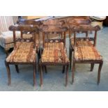 A set of six Regency side chairs, with acanthus carved rails, drop in seats, on sabre legs