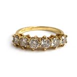 An 18ct gold and diamond six stone half eternity ring, total carat weight of the six brilliant cut