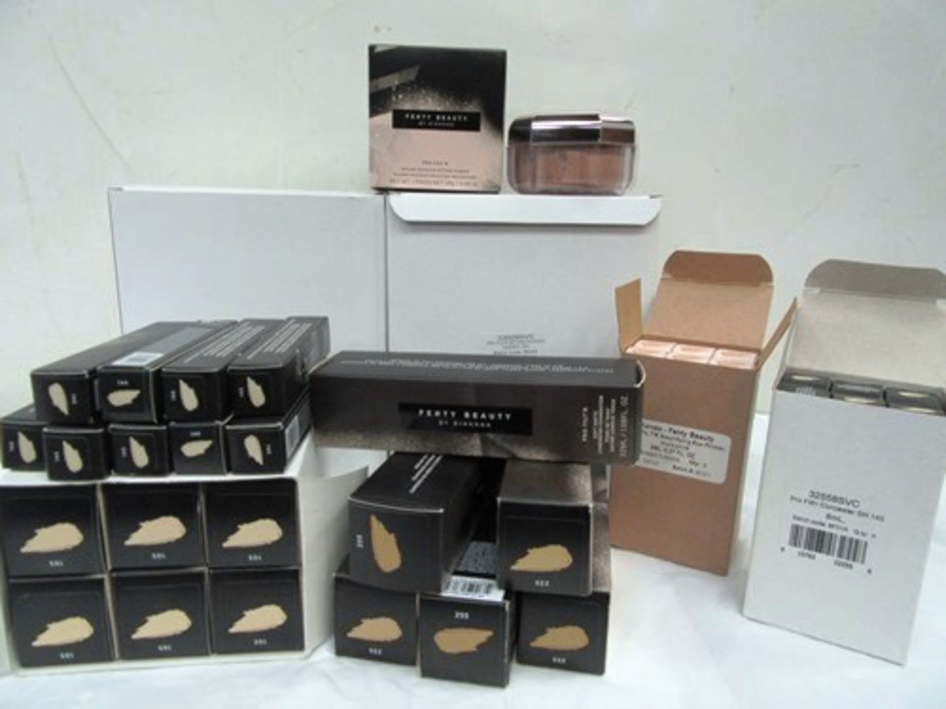 A selection of Fenty Beauty cosmetics to include 12 x 28g pots of Cashew setting powder, concealer
