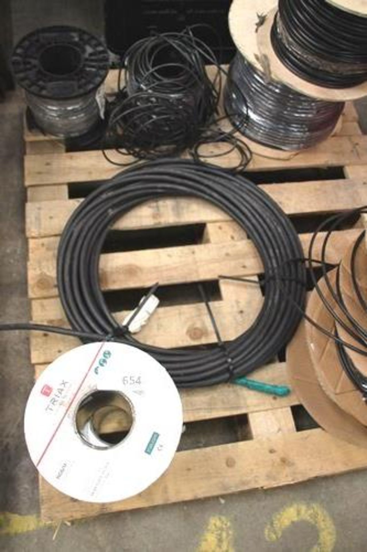 A pallet of cable including 2 x 100m of Triax black RG6/U, 1 x 100m 3 x 2.5mm2 SWA reel, 1 x 100m
