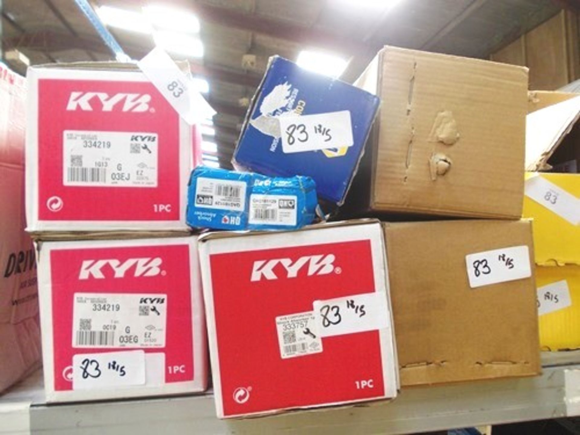 A selection of suspension parts including KYB shock absorbers, Ref: 334219 and 333757, Qunitock