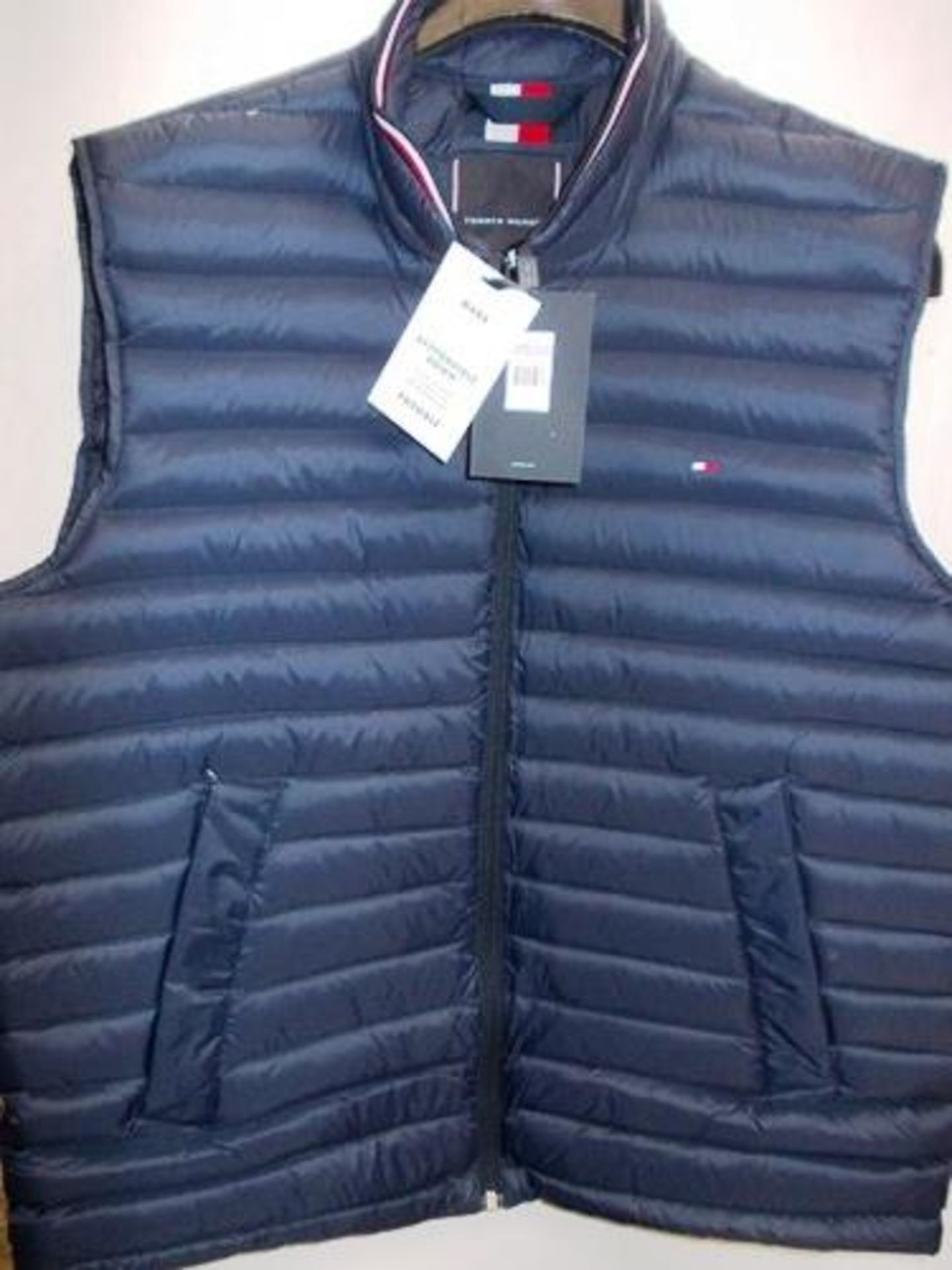 1 x Tommy Hilfiger core packable down vest, size SL and 1 x Tommy branded sweat pants, size L -