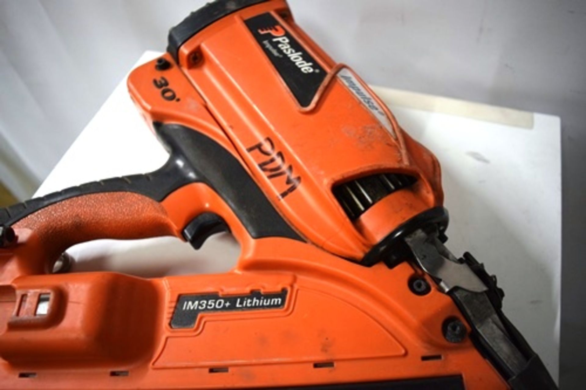 1 x Paslode Impulse nail stapler gun, model IM350+ Lithium, with 1 x charger and heavy duty case - - Image 2 of 4