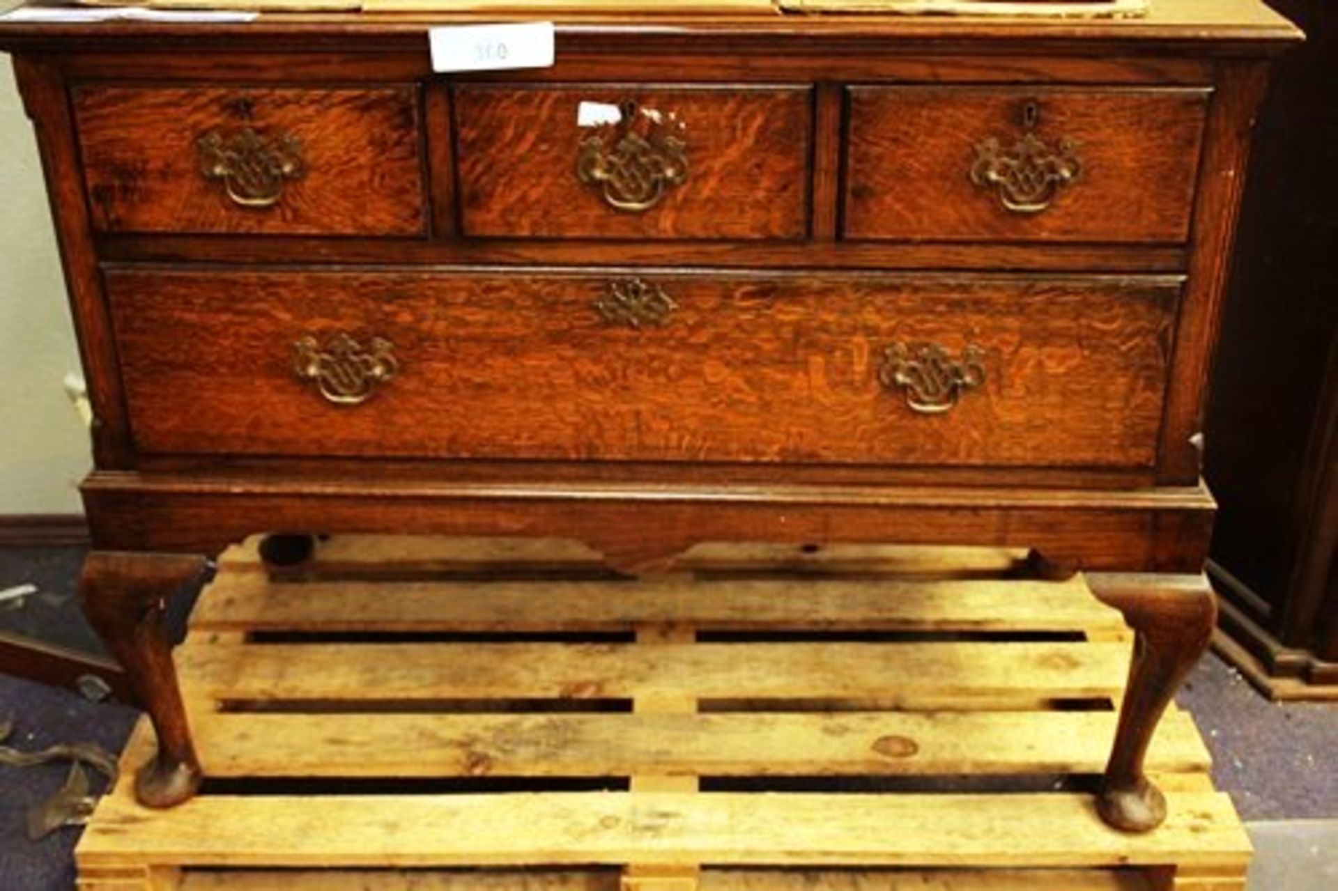 An early 20th Century oak sideboard with 3 short and 1 long drawer on cabriole legs, size 42"(W) x