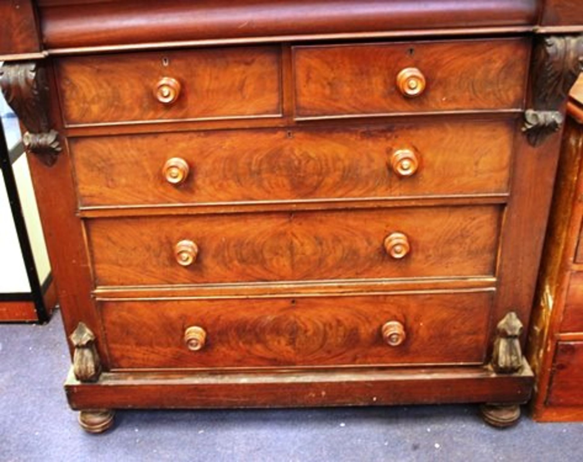 A large Victorian flared mahogany chest of drawers comprising 2 x short drawers and 3 x long