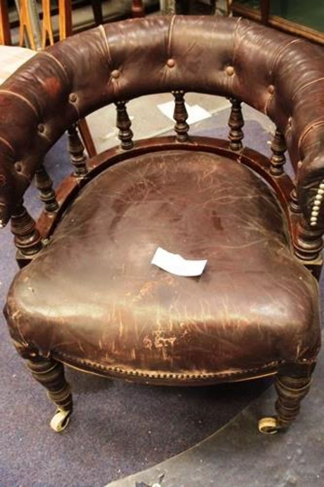 A Victorian brown leather club chair on castors - Second-hand (cabs floor)