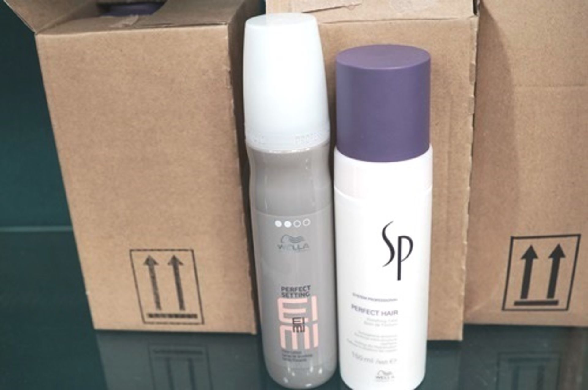 12 x 150ml bottles of Wella SP Perfect Care Cream and 6 x 150ml bottles of Wella setting spray,