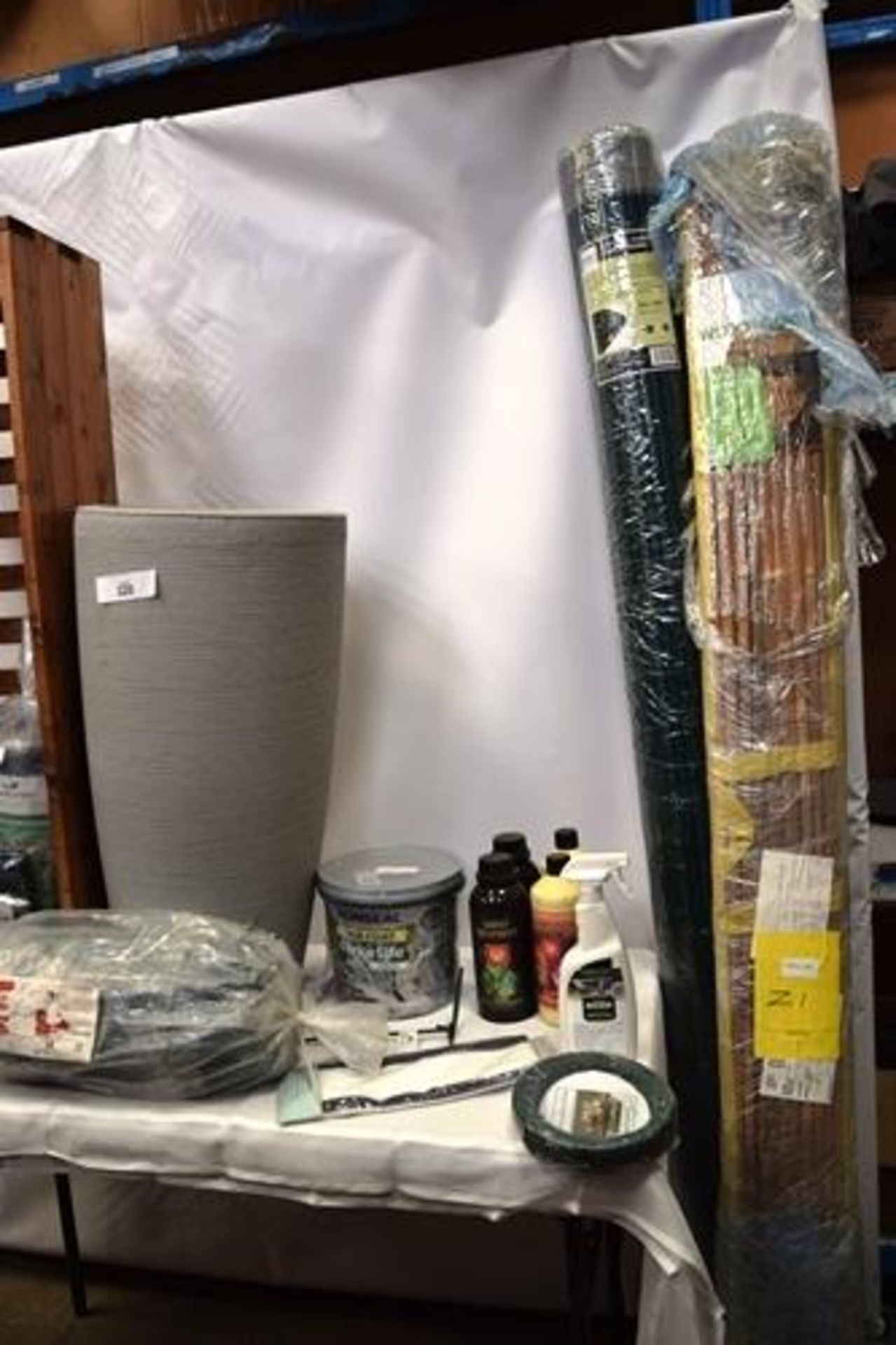 A shelf of gardening products including Ronseal One Coat Fencing Paint, 2 x wooden flower - Image 2 of 4