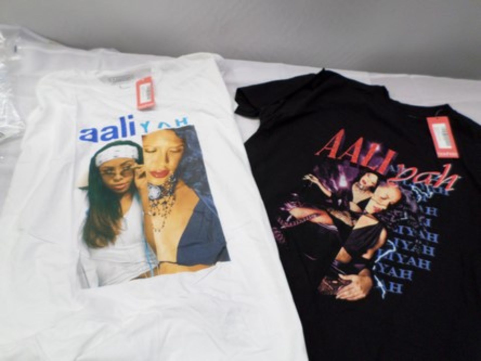 5 x boxes each containing approximately 75 x Boohoo Aaliyah Licence Split Print t-shirts, colours