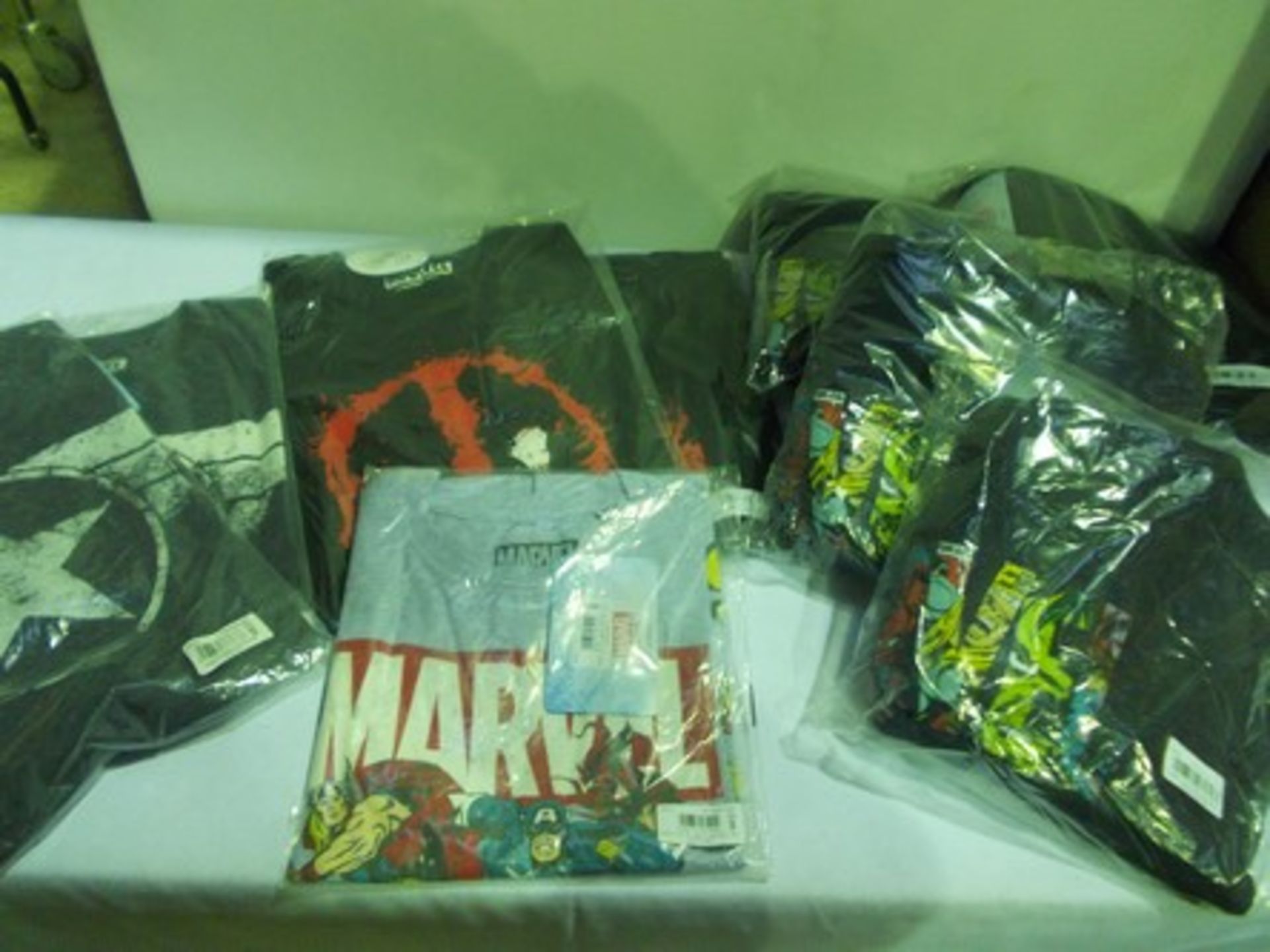 9 x items of Marvel Official Merchandising clothing comprising 4 x sweatshirts and 5 x t-shirts in