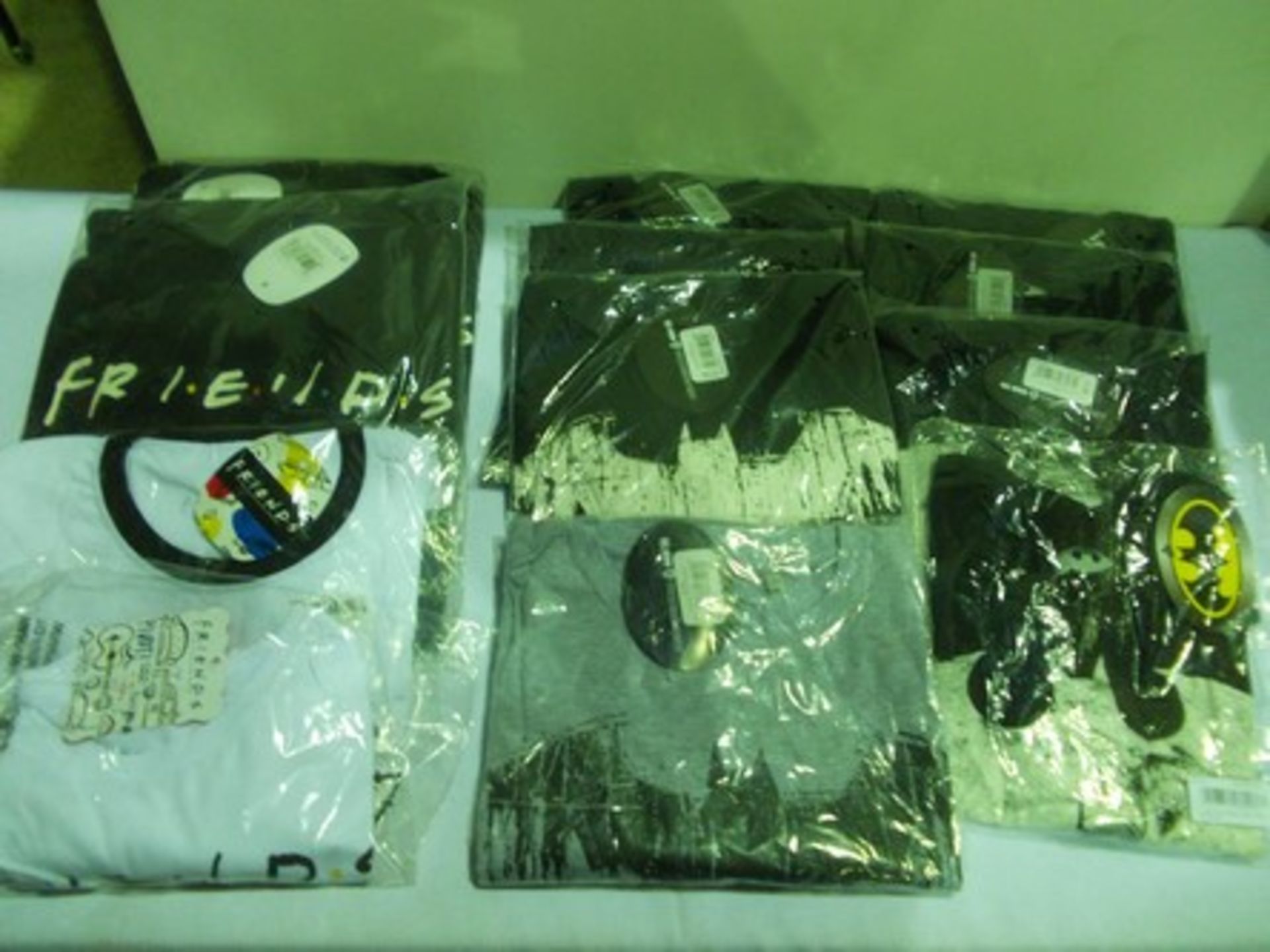 12 x Batman and Friends Official Merchandising clothing comprising 2 x sweatshirts and 10 x t-shirts