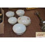 Three rose decorated eggshell teacups and saucers