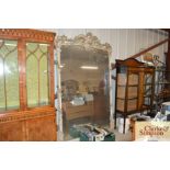 A Victorian Rococo style wall mirror of large prop