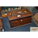 A Victorian rosewood sarcophagus shaped tea caddy