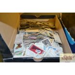 A box of various cigarette cards