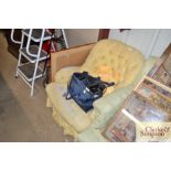 A Victorian buttoned tub shaped easy chair - in ne