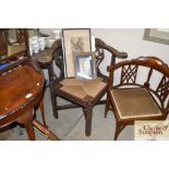 A 19th Century carved oak corner chair with rush s