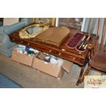 A mahogany coffee table fitted three drawers