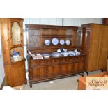 An oak linen fold decorated dresser