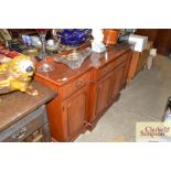 A large yew wood breakfront sideboard